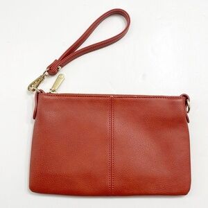 Charming Charlie burnt orange wristlet